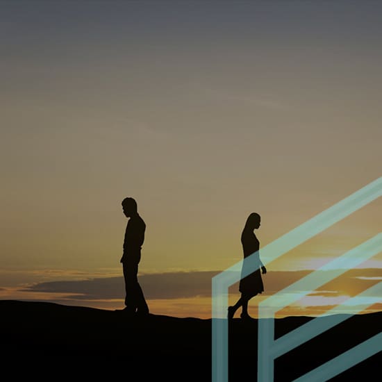 Silhouettes of a man and a woman walking away from each other against a backdrop of a golden sunset. A geometric, translucent shape appears over the image, adding an abstract element to the scene.
