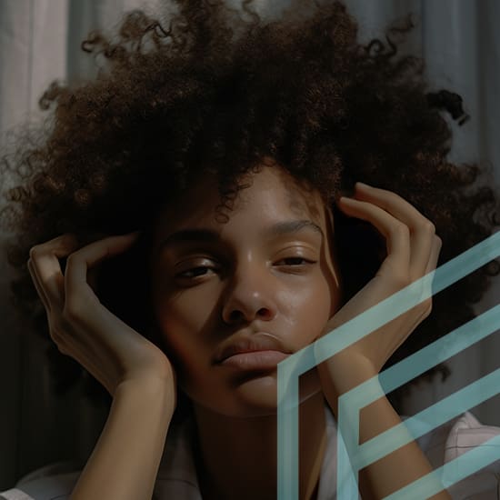 A person with curly hair rests their head in their hands. Soft light illuminates their face, casting gentle shadows. The background is neutral with diffused light. Diagonal lines partially overlay the image, adding an abstract element in the foreground.