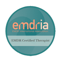 A circular badge with the text "emdria EMDR International Association" at the top and "EMDR Certified Therapist" on a banner at the bottom. The badge has a teal gradient background.