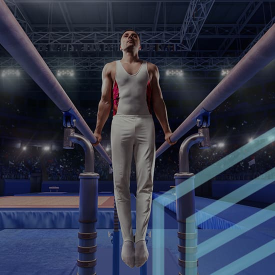 A male gymnast in a white leotard performs a routine on the parallel bars in a well-lit indoor arena. Spotlights shine down, illuminating his figure against a background of a cheering crowd.