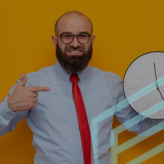 A man with a beard, glasses, and a red tie stands against an orange background, smiling and pointing to a large analog clock he holds with his other hand. The clock is partially overlayed with transparent, light blue lines resembling geometric shapes.